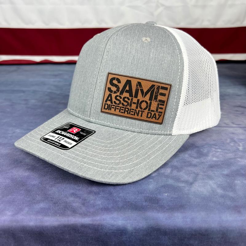 SAME ASSHOLE DIFFERENT DAY Hat
